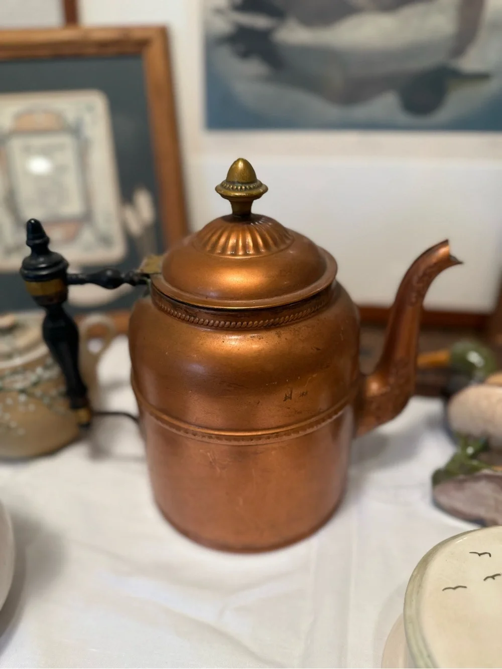 Copper-Color Metal Teapot with Black Handle and Decorative Finial